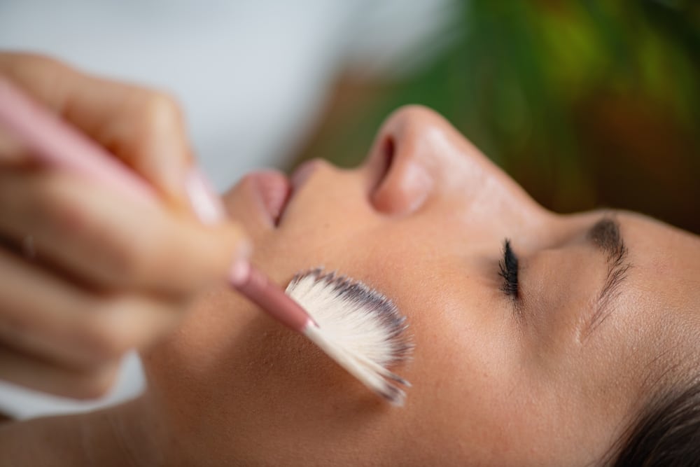 A woman having a chemical peel applied to her skin