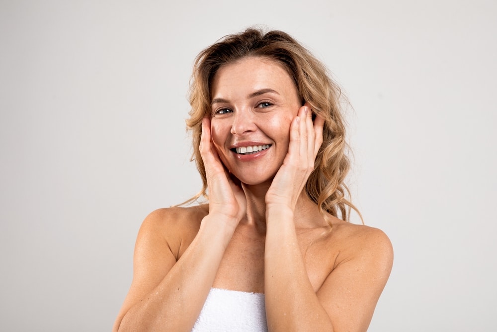 A woman smiling after a brow lift